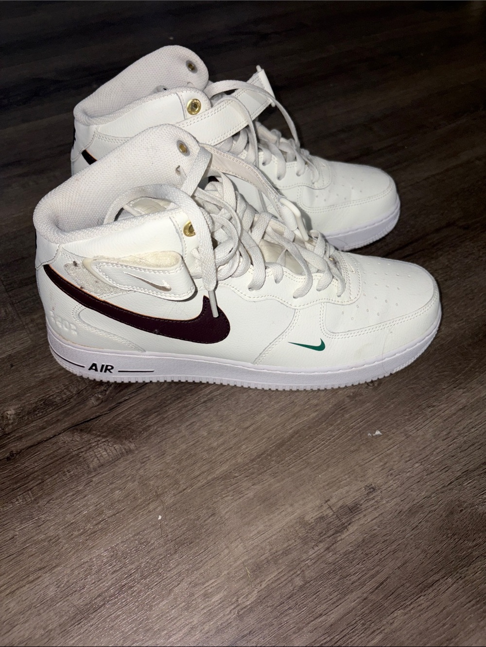 Nike White High-Top Sneakers with Maroon Swoosh and Teal Accent